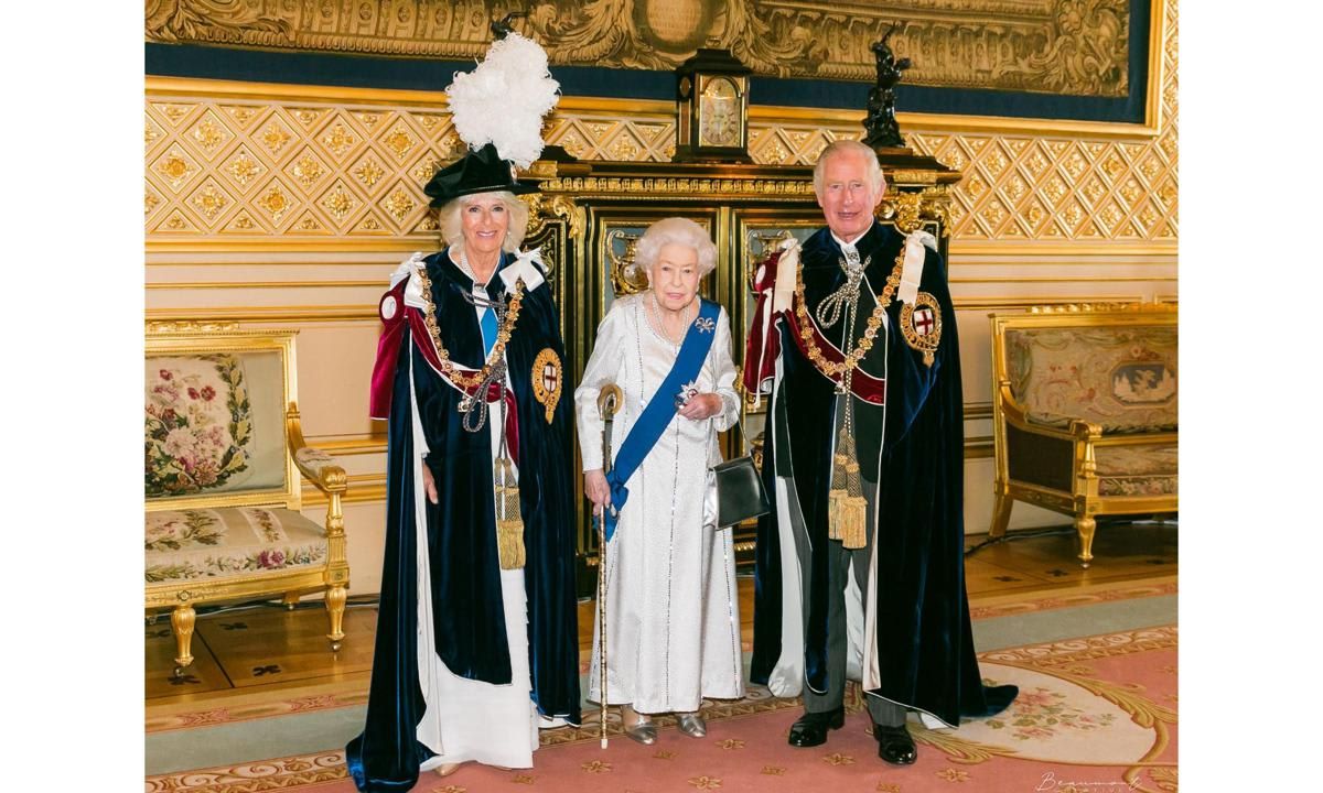 Queen Elizabeth posed for a photo with her daughter-in-law, who was formally invested as Royal Lady of the Order of the Garter, and son Prince Charles.