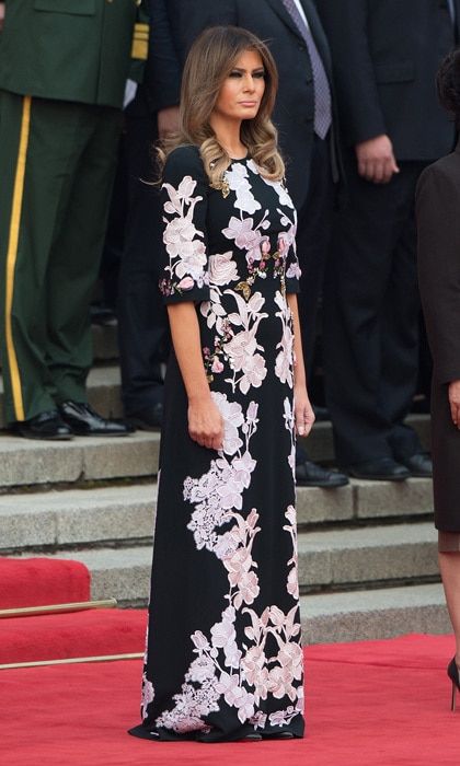 First Lady Melania Trump made a floral statement on November 9 stepping out in a floor length dress by Dolce & Gabbana for a welcome ceremony at the Great Hall of the People in Beijing.
Photo: NICOLAS ASFOURI/AFP/Getty Images