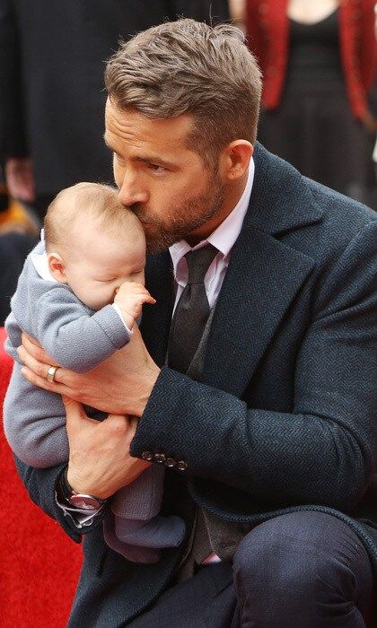 The doting dad placed a gentle kiss on his and Blake Lively's newborn daughter's head during his Hollywood Walk of Fame ceremony.
Photo: Michael Tran/FilmMagic