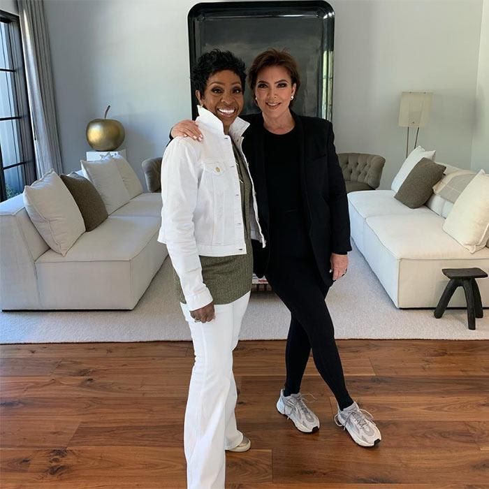 Kris Jenner at her home posing with Gladys Knight