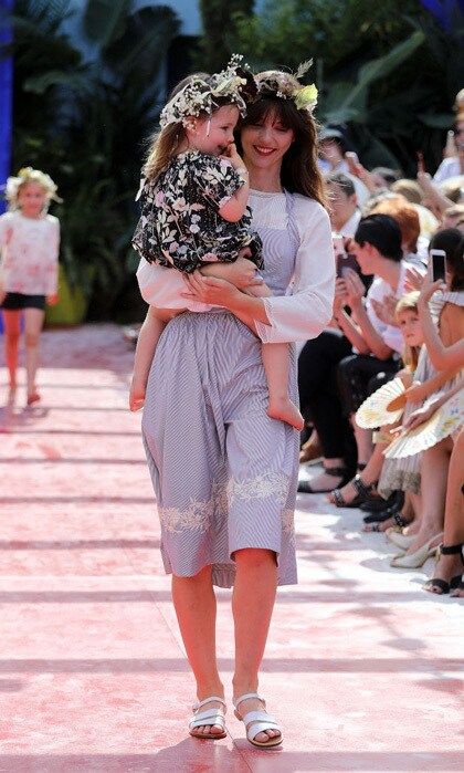 Coco Rocha's adorable two-year-old daughter Ioni Conran made her runway debut for Bonpoint. The adorable toddler was carried in the arms of a model as she wore a floral dress and a flower crown. The proud mom told WWD, "She's literally loving life, saying 'I'm gonna be in the show, I'm gonna be in the show,' and I say, 'I know, I booked you for it.'"
Photo: Getty Images