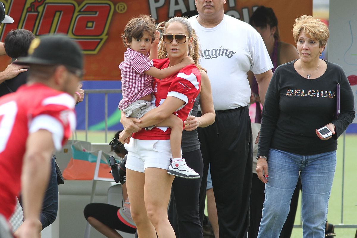 SAN JUAN, PR - DECEMBER 22:  Jennifer Lopez with her son, Max Muniz and her mother, Guadalupe Rodriguez attend the Pre-Concert Celebrity Football Game Benefiting Hurricane Sandy Relief at Hiram Bithorn Stadium on December 22, 2012 in San Juan, Puerto Rico.  (Photo by GV Cruz/WireImage)