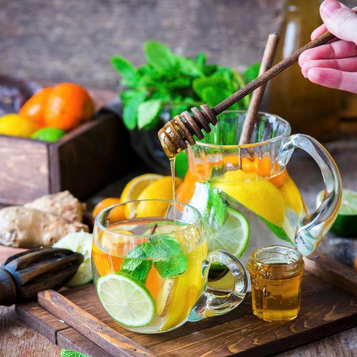 Detox water with citrus fruits, ginger and honey