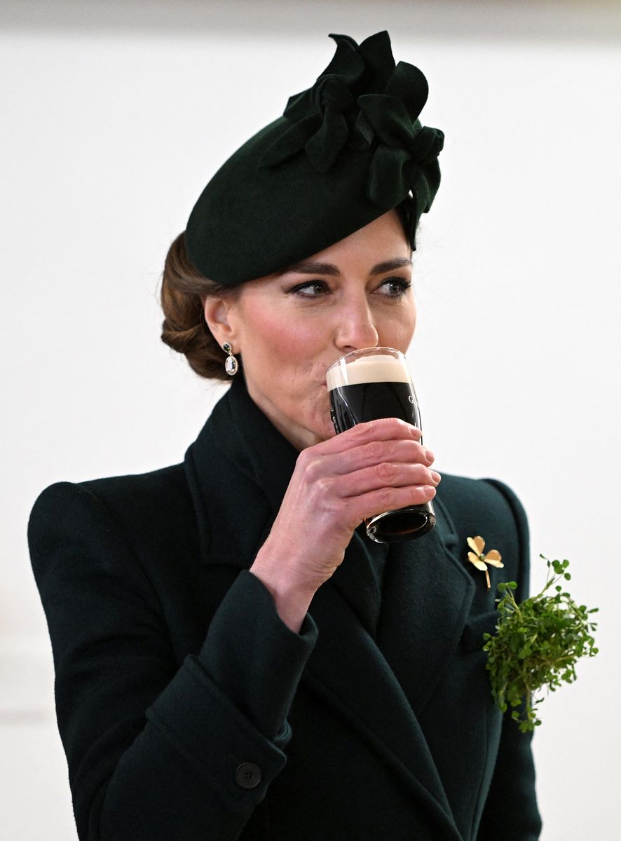 Britain's Catherine, Princess of Wales takes a sip of Guinness during her visit to Wellington Barracks, in central London, on March 17, 2025, where she met with meet with Irish Guards for their St Patrick's Day Parade. (Photo by Eddie Mulholland / POOL / AFP) (Photo by EDDIE MULHOLLAND/POOL/AFP via Getty Images)          