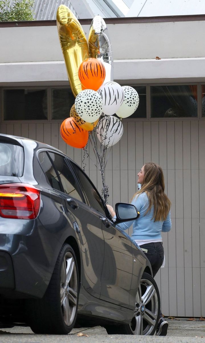 Elsa Pataky receiving balloons for birthday celebration