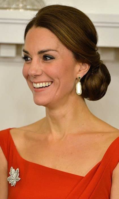 The Duchess of Cambridge put her mane in a classy up-do, simply accessorizing with a pair of earrings and the Queen's maple leaf brooch while in attendance at the Goverment of British Columbia reception at Government House on September 26, 2016 in Victoria, Canada.
Photo: Pool/Sam Hussein/WireImage