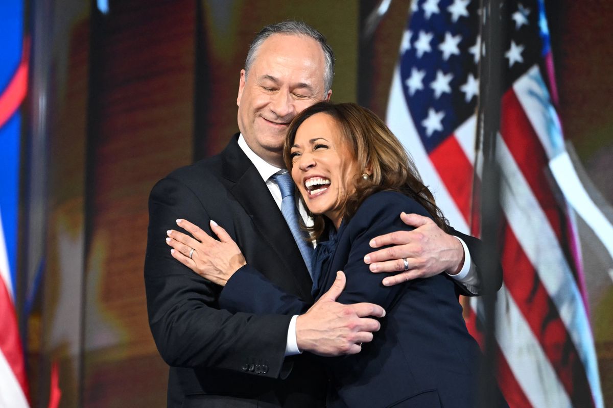 Second Gentleman Douglas Emhoff hugs Vice President and 2024 Democratic presidential candidate Kamala Harris 