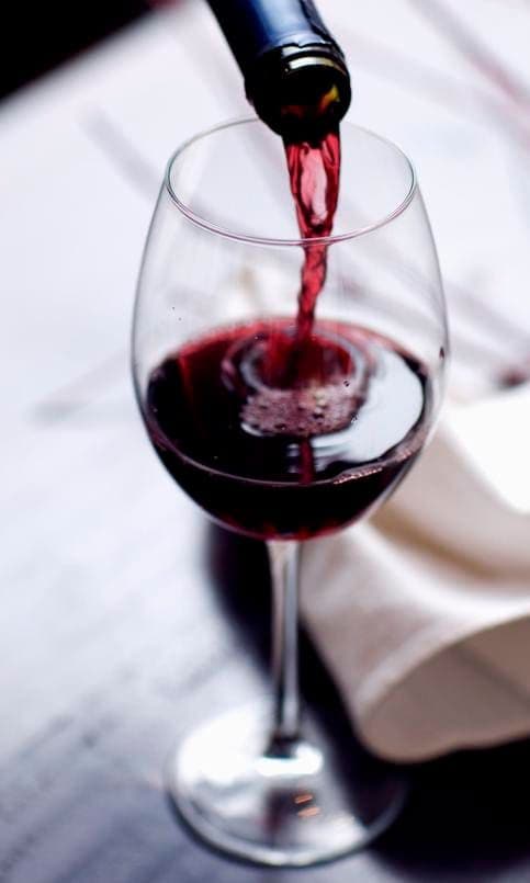 A glass of red wine can be paired with Sirtfood meals