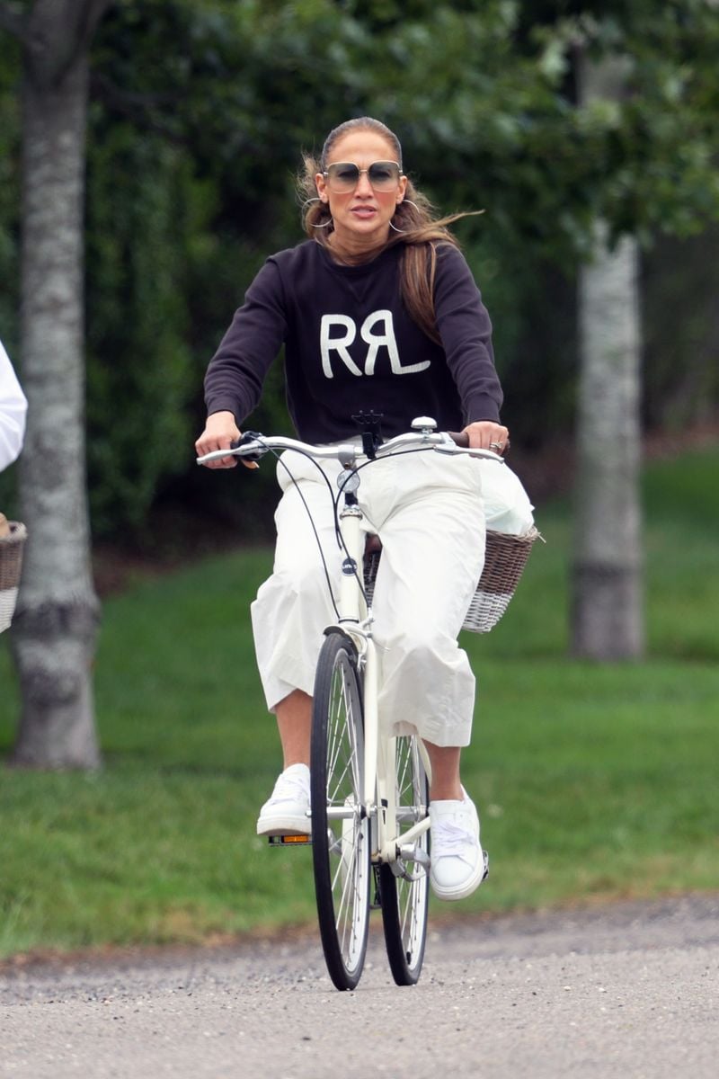 Jennifer Lopez goes out for a bike ride with friends in the Hamptons.