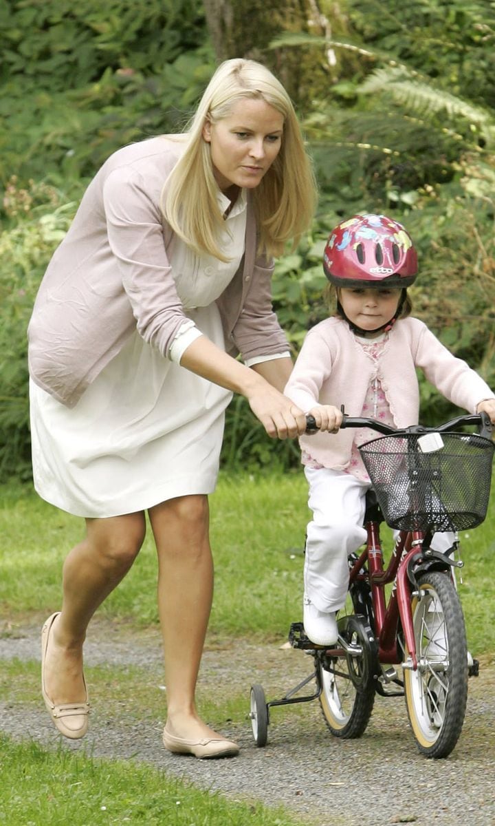 Crown Princess Mette-Marit gave her daughter Princess Ingrid Alexandra a helping on her bike in 2007.