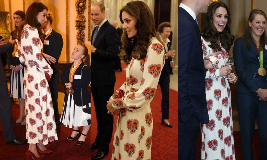 It was another gold-winning look for the Duchess of Cambridge at a reception held for Team GB Olympic and Paralympic medalists. The royal stepped out to the Buckingham Palace event sporting a poppy-printed silk gown by Alexander McQueen, which featured a nipped-waist and long, cuffed sleeves. Kate accessorized the stylish look with her bordeaux Gianvito Rossi suede pumps and a matching clutch bag.
Photo: Eddie Mulholland/The Daily Teleg PA Wire/PA Images/Twitter/@KesingtonRoyal
