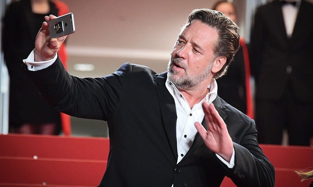 Caught in action! Russell Crowe was snapped taking a few shots himself at the Cannes Film Festival.
<br>
Photo: WireImage