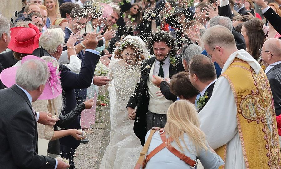 As the newlyweds left the church as husband and wife, guests who'd lined lined the path outside cheered and showered the new husband and wife with confetti and flower petals.
Photo: Getty Images