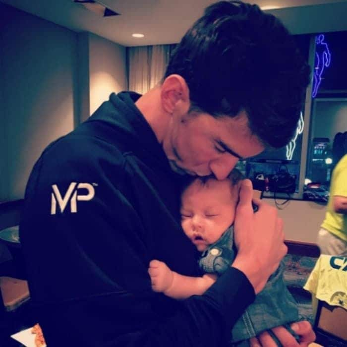 After making history by clinching his fifth trip to the Olympics, Michael celebrated with a kiss from his baby boy.
<br>
Photo: Instagram/@nicole.m.johnson