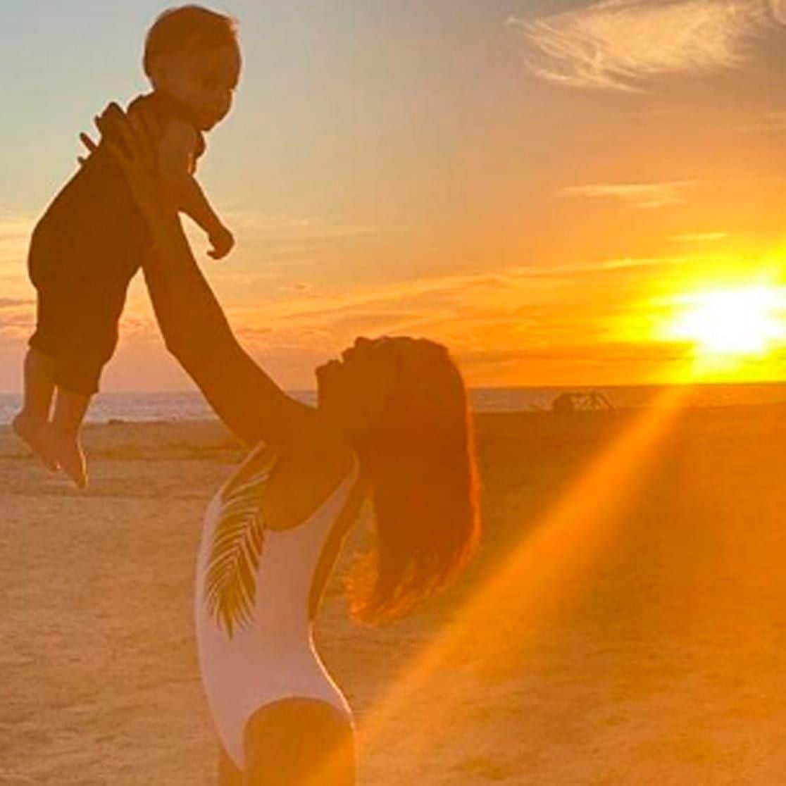 Eva Longoria experiencing a Cabo sunset with baby Santiago