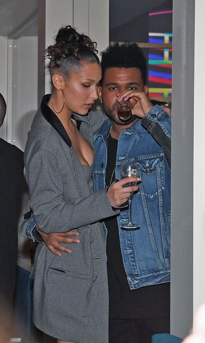 The Weeknd kept Bella Hadid close while she held on to her Perrier-Jouet champagne during a late night party in Cannes.
Photo: Splash News