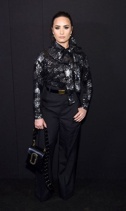 Demi Lovato brought the glamour to Marc Jacobs wearing a dazzling blouse and dark high-waisted trousers.
Photo: Jamie McCarthy/Getty Images for Marc Jacobs