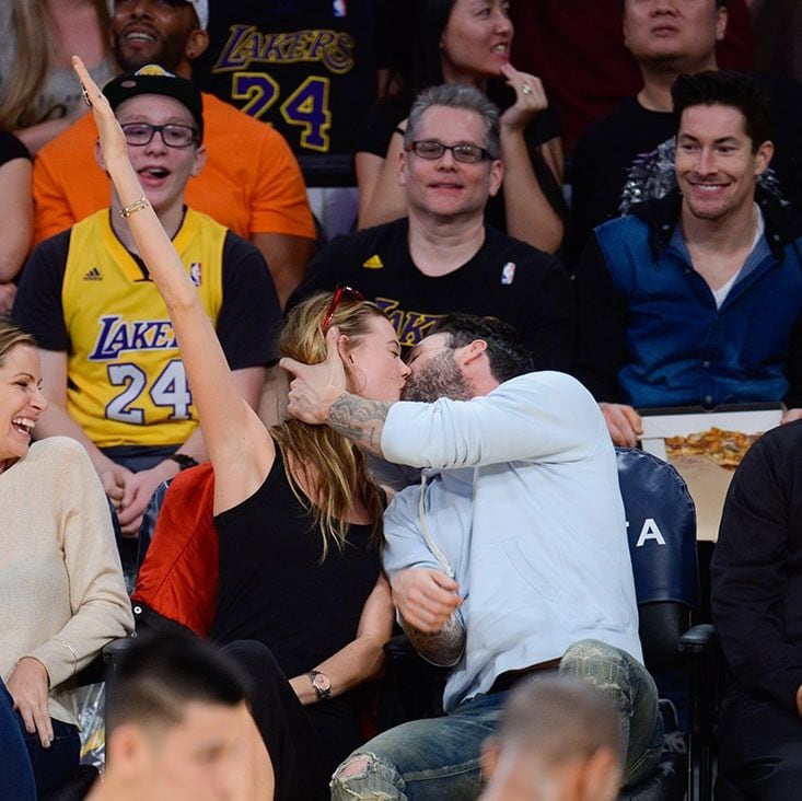 Where's the Kiss Cam? Adam Levine and Behati Prinsloo kissed courtside at an LA Lakers game.
Photo: Getty Images