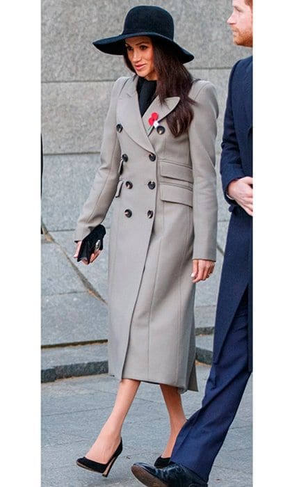 Meghan had an early start on April 25, attending a service at dawn to commemorate Anzac Day, which honors Australia's and New Zealand's lost veterans. The royal bride-to-be joined Prince Harry at 5am at Wellington Arch, Hyde Park Corner, dressed in a full-length grey coat by Canadian brand Smythe and Sarah Flint high heel shoes. The actress accessorized with a clutch, wide-brimmed hat and traditional poppy pin.
Photo: Getty Images