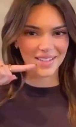 Kendall Jenner showing off her lip products