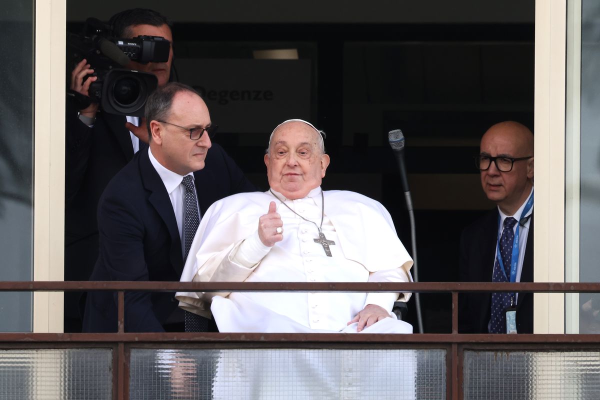 Pope Francis greets and blesses the faithful from a balcony of the Gemelli Hospital on March 23, 2025, in Rome, Italy. 