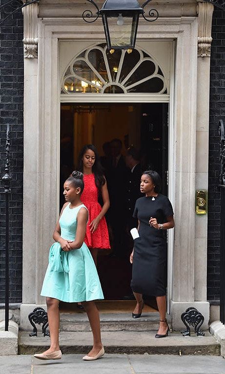 June 2015: London calling! Sasha looked elegant in pale blue, while Malia kept it cool in a coral dress during their visit with British Prime Minister David Cameron.
<br>
Photo: Getty Images