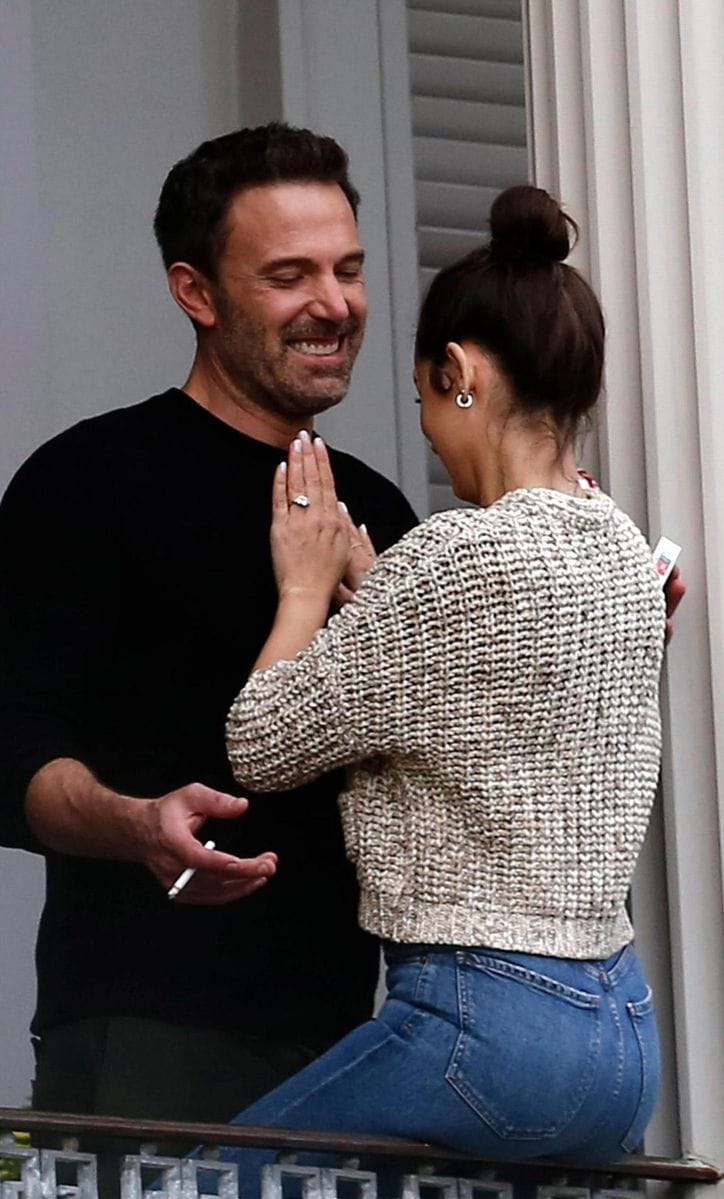 Ben Affleck and Ana de Armas on a balcony.