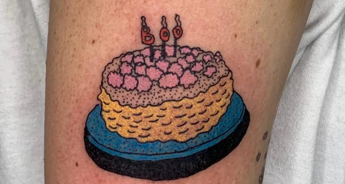 Birthday cake on her right arm