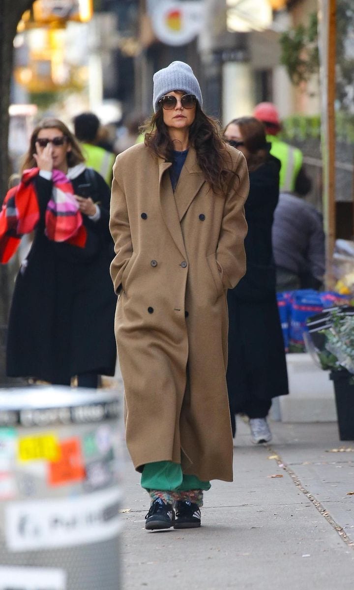 Katie Holmes bundles up in a long tan coat and a gray beanie as she runs a few errands in New York