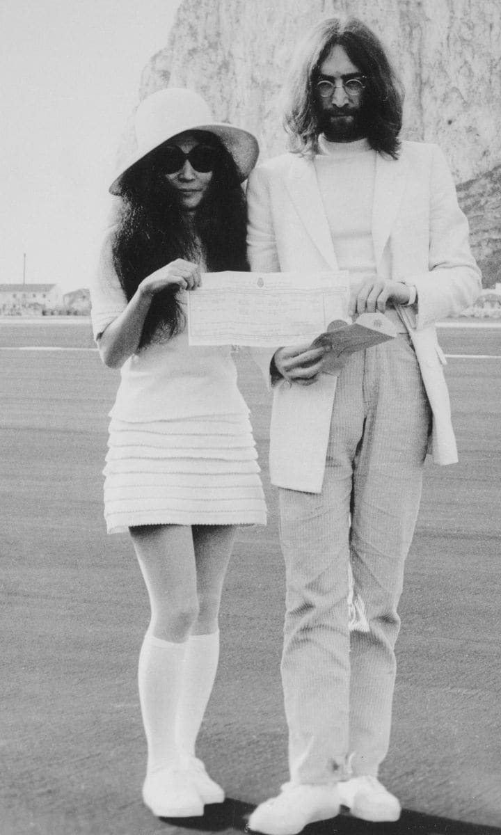 John Lennon and Yoko Ono Holding Marriage Certificate