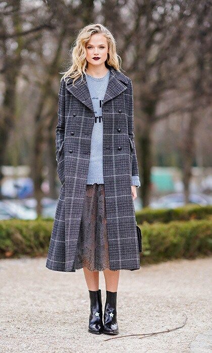 We love British actress Gabriella Wilde's eclectic layers a long grey check coat, a distressed pullover, and sheer lace skirt spotted outside Dior.
Photo: Edward Berthelot/Getty Images