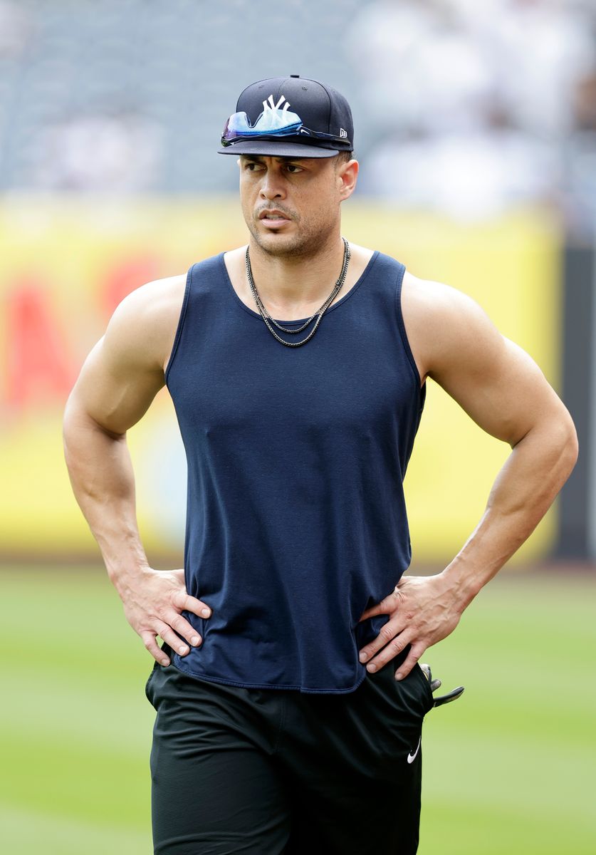  Giancarlo Stanton, #27 of the New York Yankees, works out on the field before a game against the Cincinnati Reds at Yankee Stadium on July 04, 2024 in New York City. The Reds defeated the Yankees 8-4. 