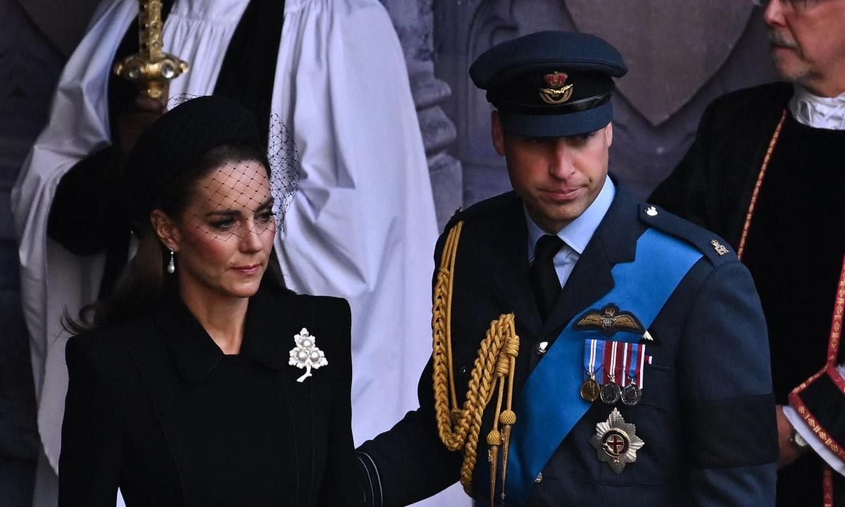 The Prince of Wales, seen with his wife after a service for the reception of the Queen's coffin, walked next to his brother Prince Harry during the procession on Sept. 14.