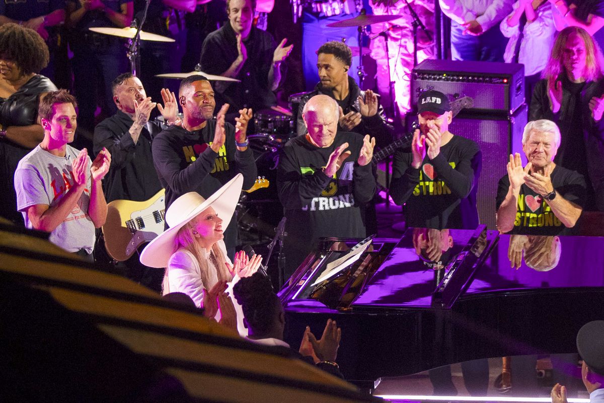 
Lady Gaga performs on Bourbon Street in New Orleans ahead of Super Bowl LIX. Also pictured were Tom Brady, Jerry Jones, Terry Bradshaw, Michael Strahan, Howie Long, Jimmy Johnson, and others sports personalitie.