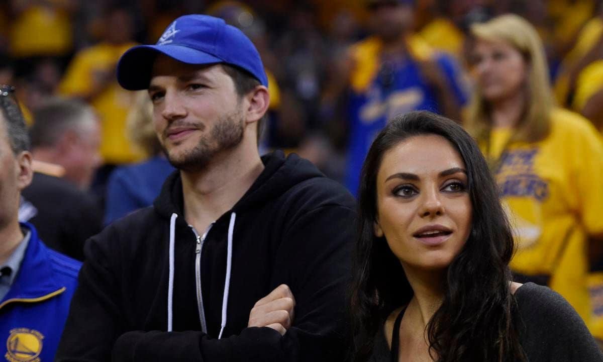Mila Kunis stands with her husband Ashton Kutcher before Game 2 of the NBA Finals at Oracle Arena in Oakland, Calif., on Sunday, June 5, 2016. (Jose Carlos Fajardo/Bay Area News Group)