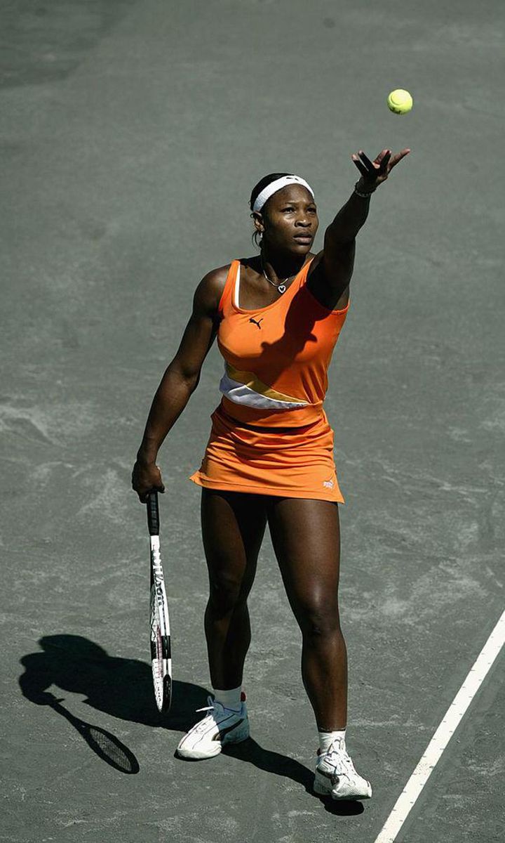 Serena Williams hits a serve to Lindsay Davenport during the Family Circle Cup April 12, 2003