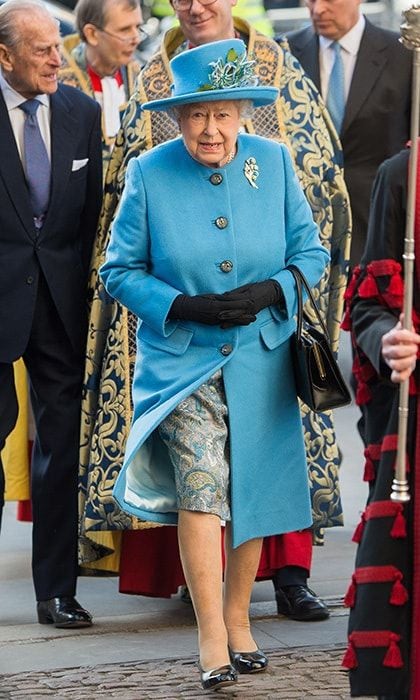 The Queen wore a bright blue coat and matching hat to combine with her paisley silk dress on Commonwealth Observance Day, March 14, 2016, in London. Completing the outfit her signature matching gloves, sensible shoes and handbag, which is always on her left arm.
Photo: Samir Hussein/WireImage