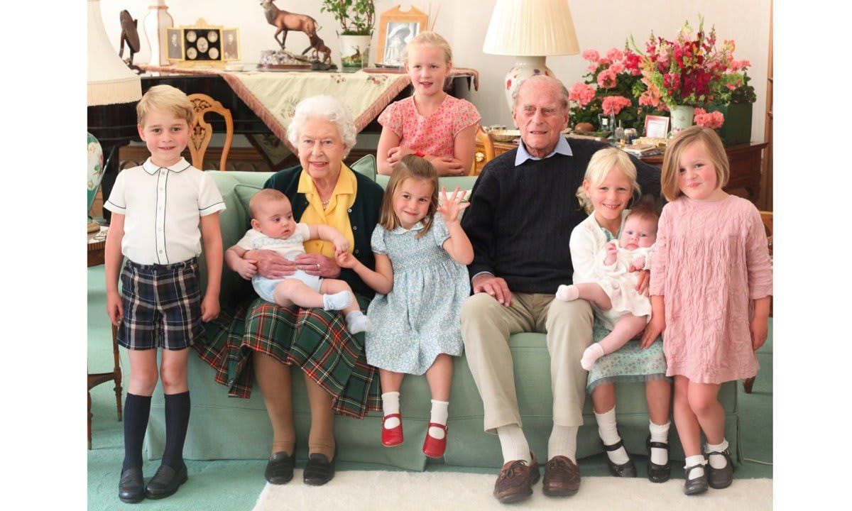 A never before seen photo of Queen Elizabeth and Prince Philip with seven of their great grandchildren was released days after the Duke of Edinburgh's death