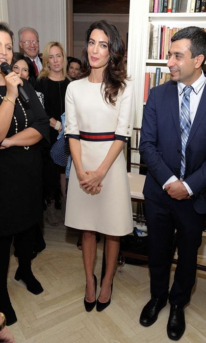 George Clooney's wife looked polished wearing a white crepe wool silk short sleeve dress by Gucci to the Women in the World reception honoring the appointment of her client Nadia Murad as a Goodwill Ambassador. Amal's chic frock featured GG pearl buttons and a grosgrain Web waistband.
Photo: Matthew Eisman/Getty Images