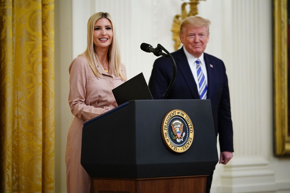 Senior Advisor to the President Ivanka Trump, with US President Donald Trump, speaks in the East Room of the White House in Washington, DC.