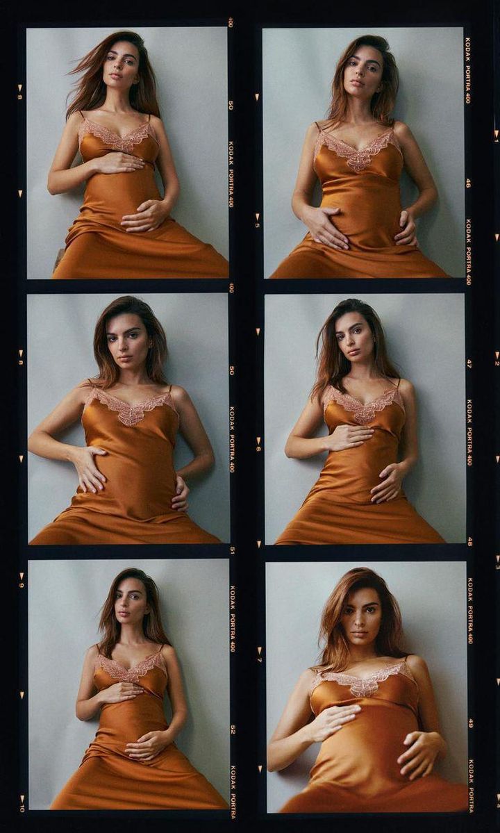 Emily Ratajkowski photoshoot for Vogue. Pregnant in orange dress holding bump.