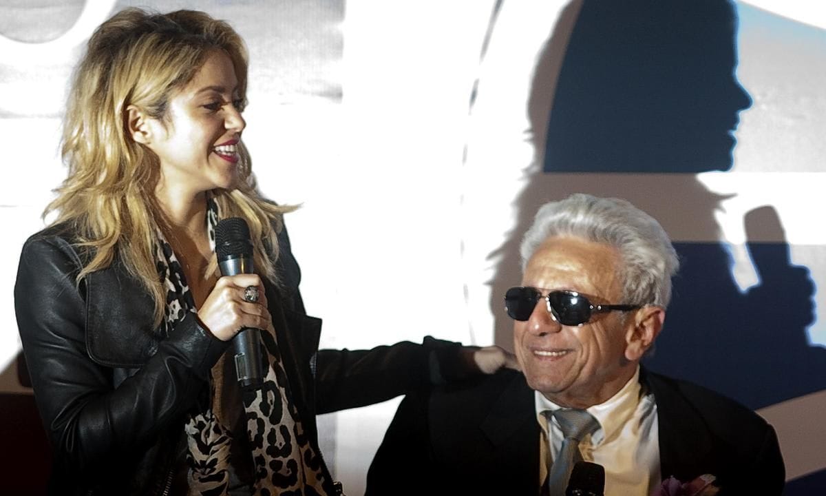 Colombian musician Shakira (L) speaks ne