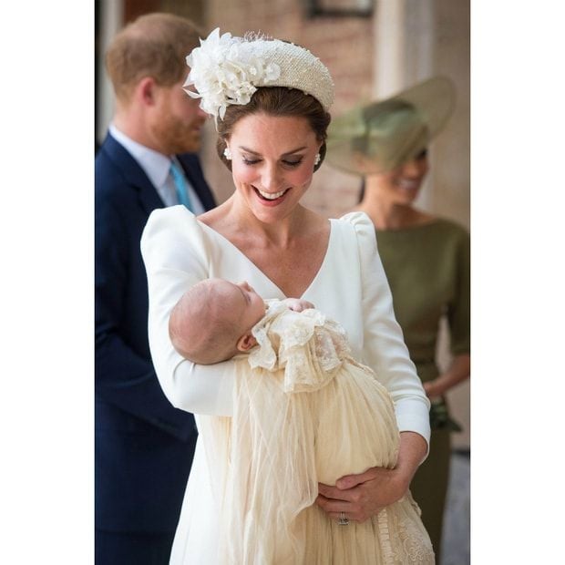 Third time's a charm! Duchess Kate opted for a cream Alexander McQueen dress for her son Prince Louis' christening. In keeping with her own tradition, she opted for the color and designer for her third child's big day. The royal mom-of-three looked elegant wearing her royal wedding dress designer and a matching hat embellished with flowers by Jane Taylor.
Photo: Getty Images