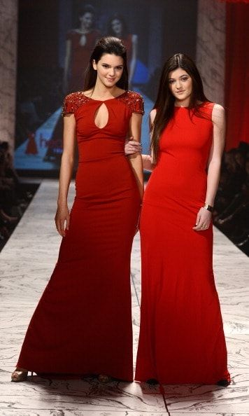 Kendall and Kylie looked very mature in these classic red dresses for a 2013 fashion show.
<br>
Photo: Getty Images