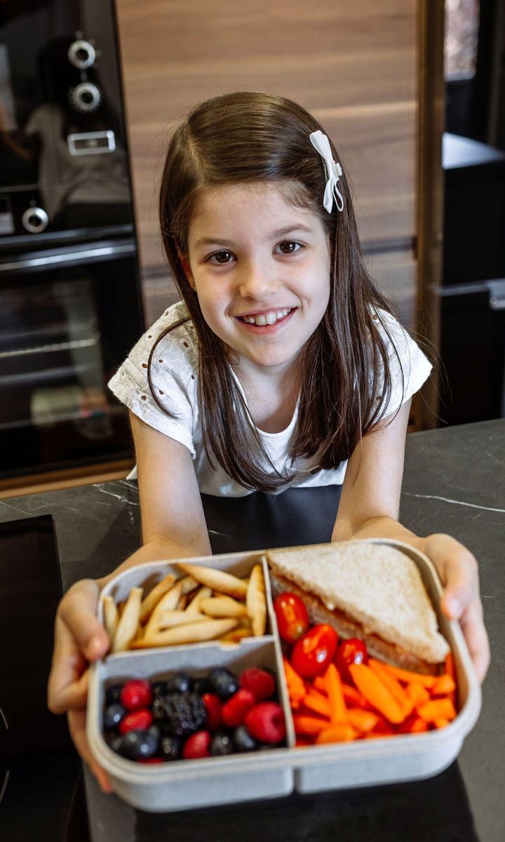 Kids holding bento box