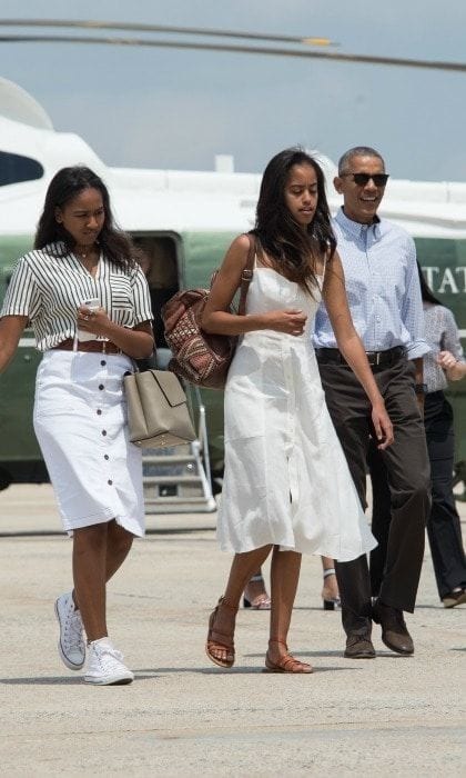 Sasha and Mailia looked chic in their summer attire as they touched down for their family vacation.
<br>
Photo: Getty Images