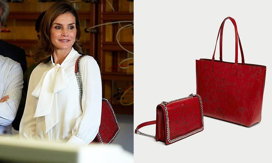 On September 27, 2017, Queen Letizia accessorized with this chain-embellished purse from Zara's fall collection to check out a vocational training course in Teruel, Spain. The laser cut leather crossbody bag is embossed with sketches of faces and retails for $119.
Photos: Manuel Queimadelos Alonso/WireImage, zara.com