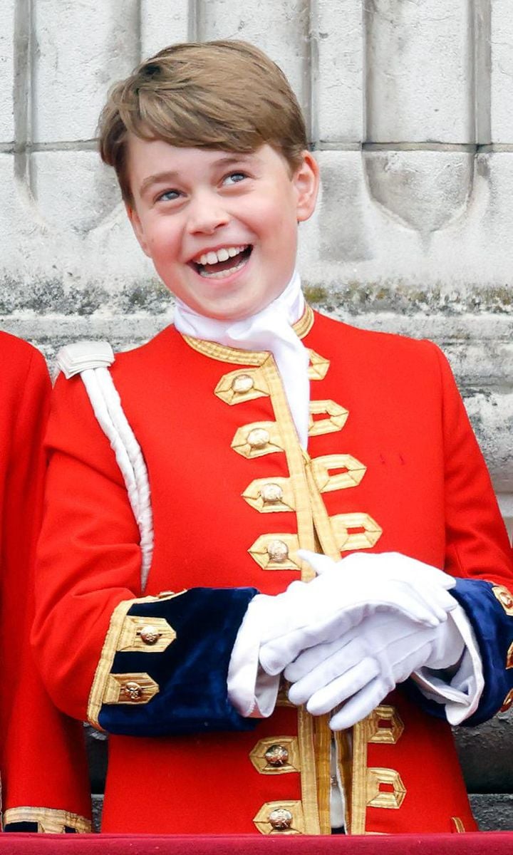 George, who served as one of his grandfather's Pages of Honour at the coronation, laughed while on the balcony of Buckingham Palace.