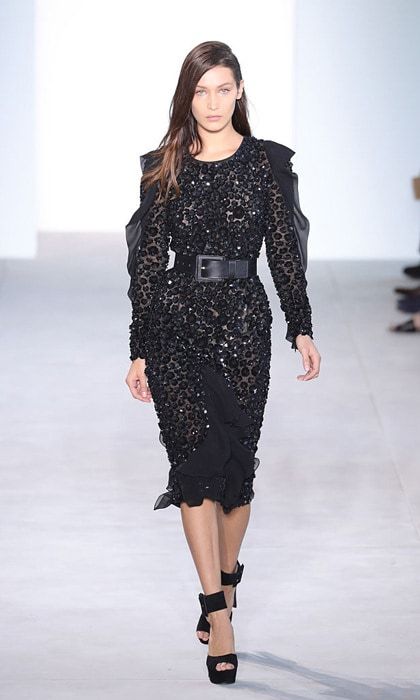 Bella Hadid looked ultra glam modeling an embellished black dress at the Michael Kors show. During the show, the model took a tumble before getting up and continuing down the runway.
Photo: Antonio de Moraes Barros Filho/FilmMagic