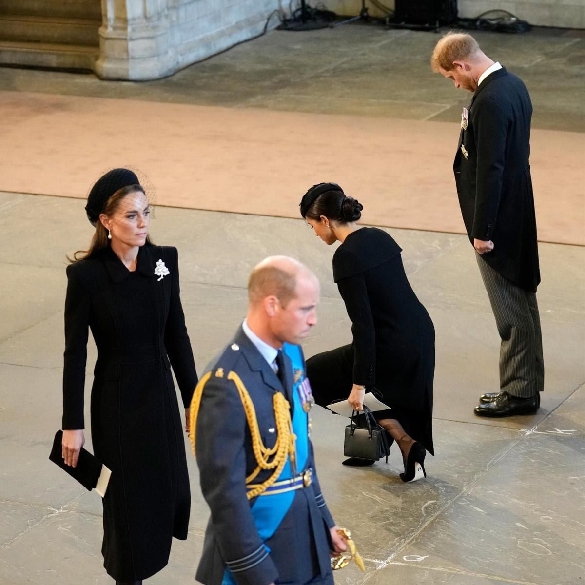 Prince Harry bowed his head as his wife curtsied.